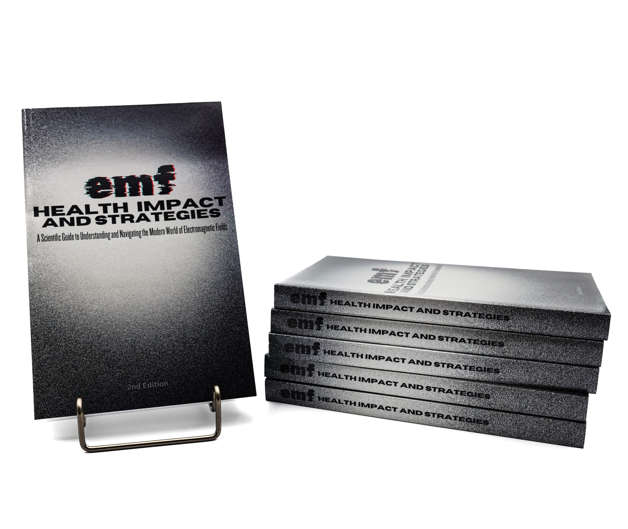 Stack of books titled 'emf Health Impact and Strategies' on a white background