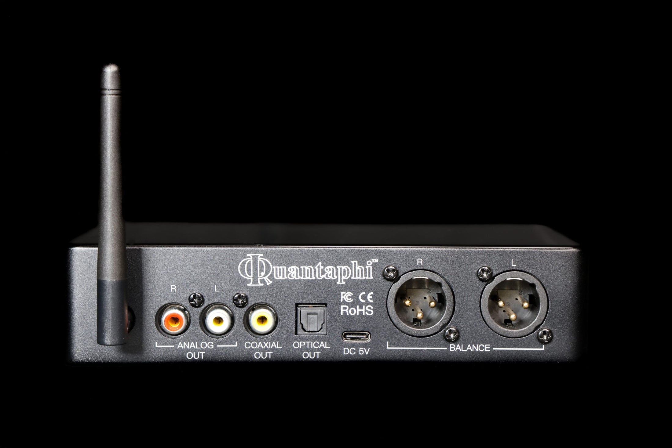Back view of a Quantaphi audio device with various connectors on a black background