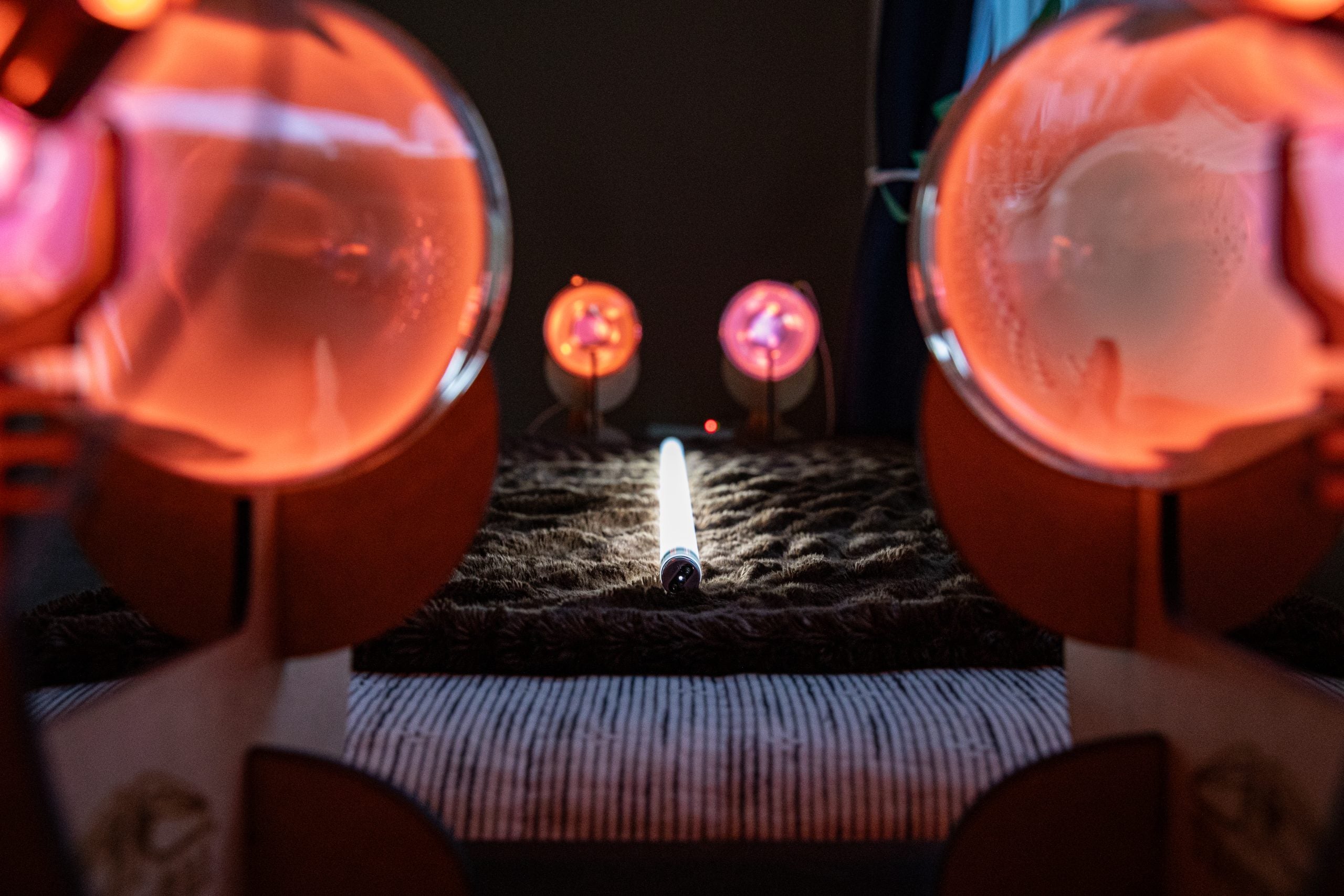tunnel view of the quad tube theraphi setup with a fluorescent bulb on the bed