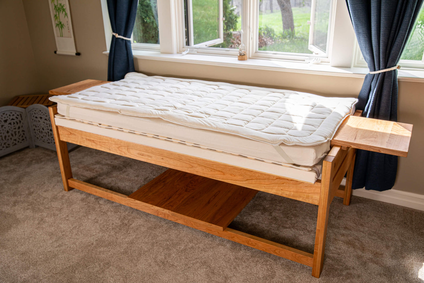 theraphi bed in front of a window