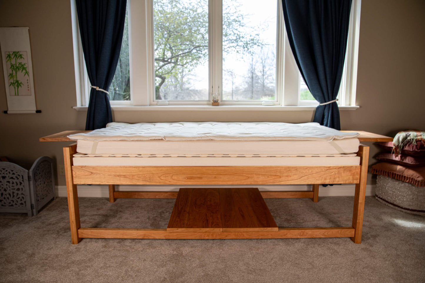 theraphi bed in front of a window