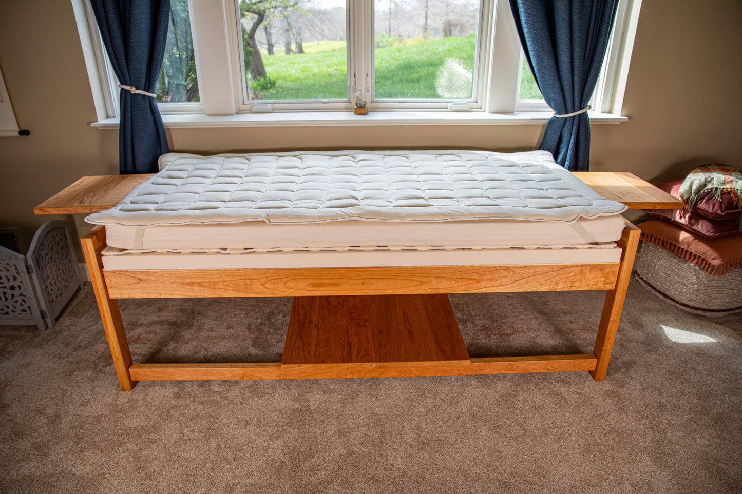 theraphi bed in front of a window